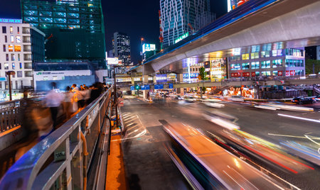 TOKYO, JAPAN - SEPTEMBER 25, 2017: People and traffic cross a busy intersection in Shibuya, Tokyo Japan at night.のeditorial素材