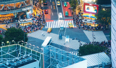 TOKYO, JAPAN - SEP, 25 2017: People cross the famous intersection in Shibuya, Tokyo, Japan one of...