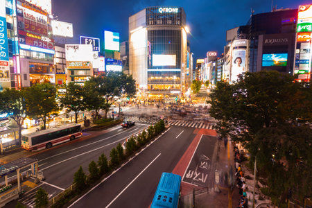 TOKYO, JAPAN - SEPTEMBER 25, 2017: Traffic crosses the Shibuya Scramble crosswalk, one of the busiest intersections in the world.のeditorial素材