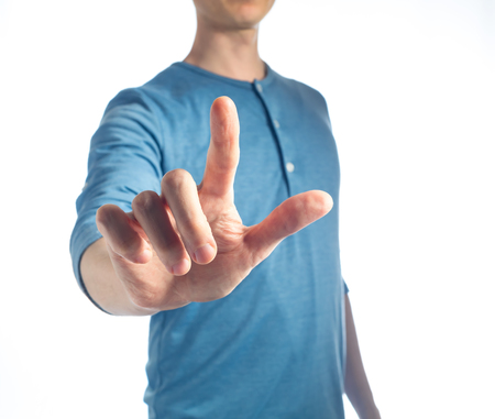 Man in pointing or pressing something on a white backgroundの写真素材