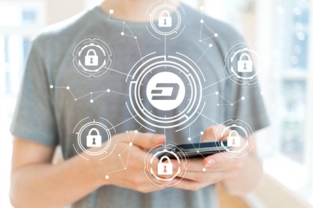 Dash cryptocurrency security theme with young man using a smartphone