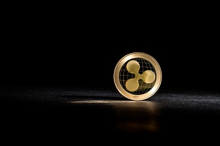 Ripple cryptocurrency coin on a dark backgroundの写真素材