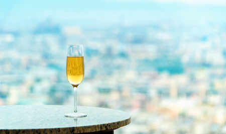 White wine on a table high above the cityの写真素材