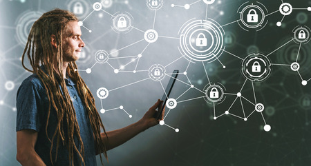 Cyber security with young man using his tabletの写真素材