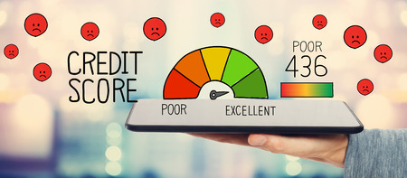 Poor Credit Score with man holding a tablet computerの写真素材