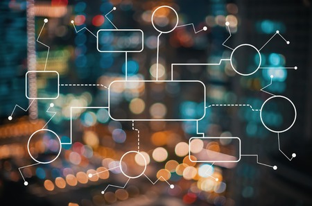 Flowchart with blurred city abstract lights backgroundの写真素材