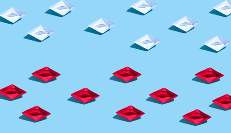 Paper origami boat in different directions concept