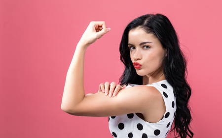 Powerful young woman in a success poseの写真素材