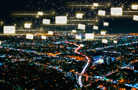Emails with Downtown Los Angeles at nightの写真素材