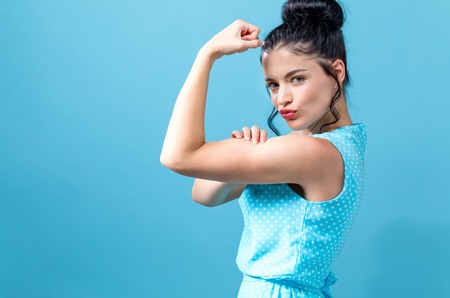 Powerful young woman in a success poseの写真素材