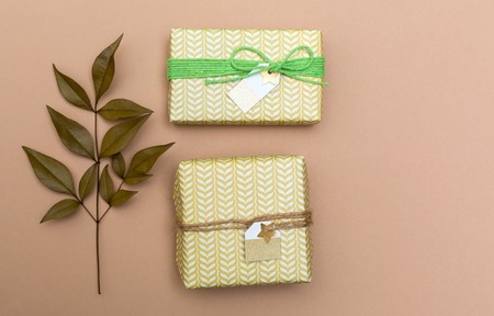 Autumn themed present boxes on a light brown paper background