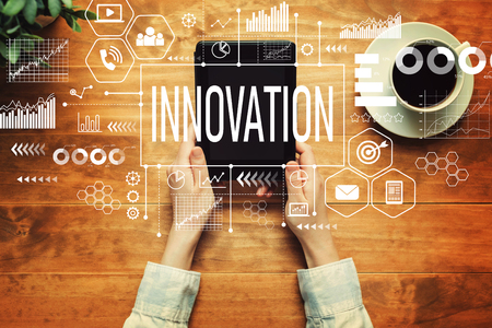 Innovation with a person holding a tablet computerの写真素材