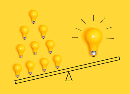 Many ideas versus one big idea with light bulbsの写真素材