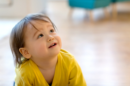 Happy toddler boy playing in his houseの写真素材