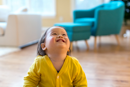 Happy toddler boy playing in his houseの写真素材
