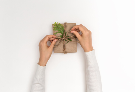 Making a Christmas gift box on a white backgroundの写真素材