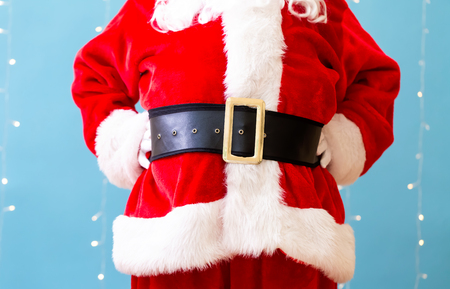 Santa claus on a shiny light blue backgroundの写真素材