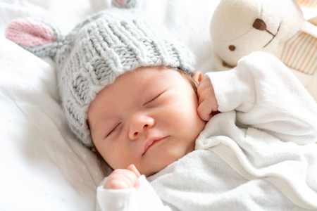 Newborn baby boy laying down on a blanketの写真素材