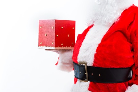 Santa opening a gift box isolated on white backgroundの写真素材