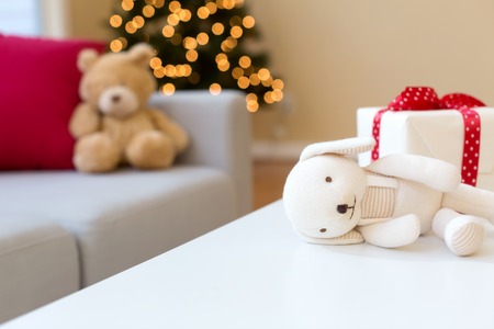Christmas gift box on a table in a living roomの写真素材