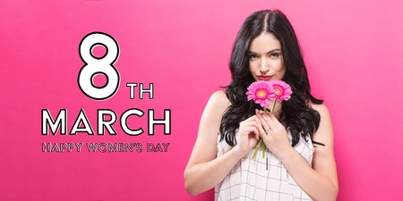 Womens Day message with young woman with garbela flowers