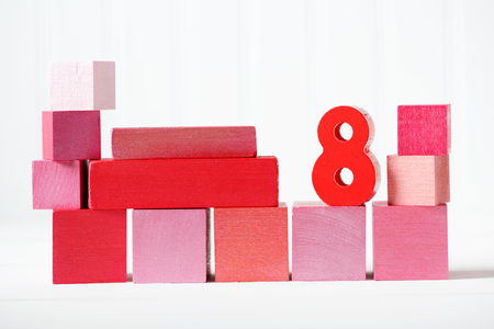 Red and pink wooden blocks with number 8 --- Womens Day March 8の写真素材