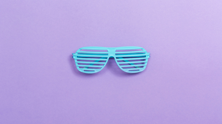 Shutter shade party glasses on a purple paper backgroundの写真素材