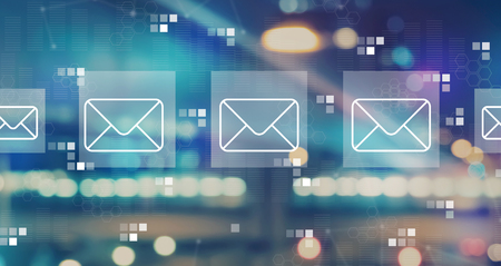 Emails with blurred city abstract lights backgroundの写真素材