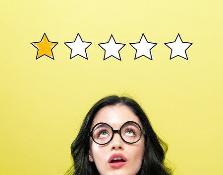 One star rating with young woman wearing eye glasses