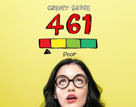 Poor credit score theme with young woman wearing eye glasses
