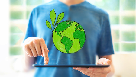 Save earth with young man using a tablet computerの写真素材
