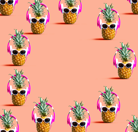 Round frame of pineapples wearing headphones on a solid color background