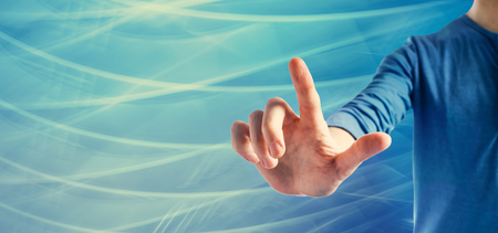 Man pointing something on a blue backgroundの写真素材