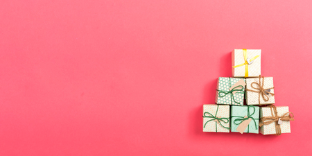 Collection of gift boxes on a pink paper backgroundの写真素材