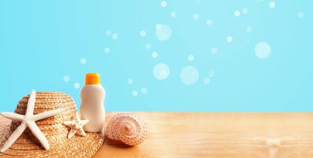 Sunblock Bottle with hat on a solid background