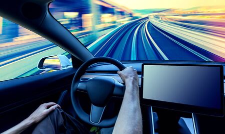 Person driving a new electric vehicle from inside