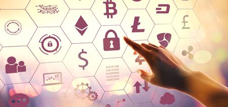 Cryptocurrency with hand pressing a button on a technology screen