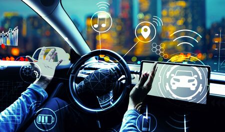 Person using a car in autopilot mode hands freeの写真素材