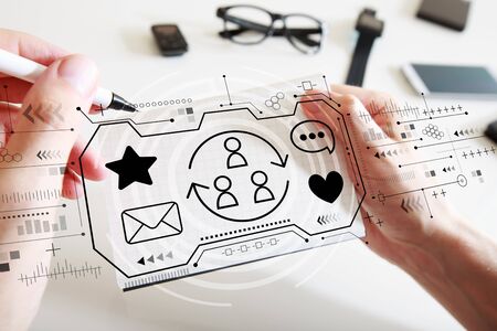 Social media theme with man writing in a notebookの写真素材