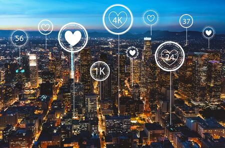 Get more likes concept with downtown Los Angeles at nightの写真素材