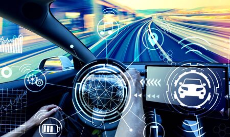 Person driving a new electric vehicle from insideの写真素材