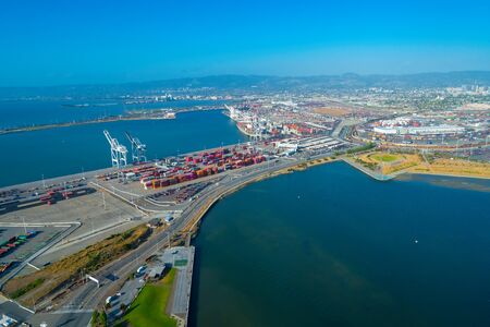 Oakland Harbor port terminal with shipping containersの写真素材