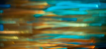 Blurred abstract bokeh background of city lights at nightの写真素材