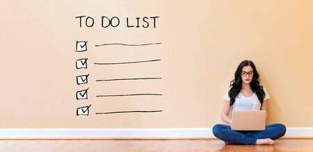 To do list with young woman using a laptop computer