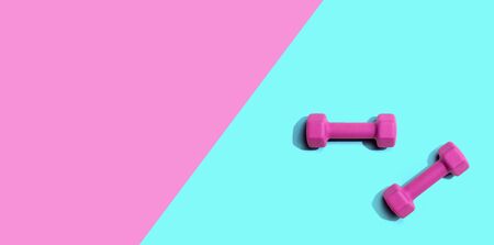 Dumbbells with hard shadow from above - overhead view