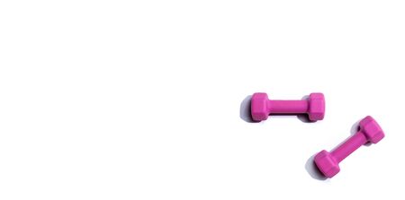 Dumbbells with hard shadow from above - overhead viewの写真素材