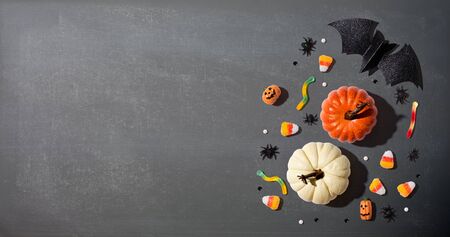 Pumpkins with Halloween decorations - overhead view flat lay