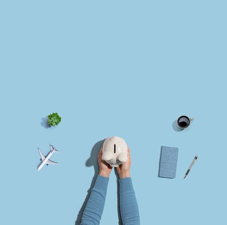 Person holding a piggy bank from aboveの写真素材