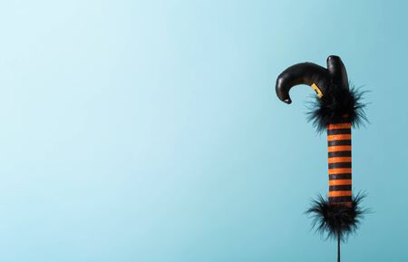 Halloween theme with witches leg decoration on a blue backgroundの写真素材