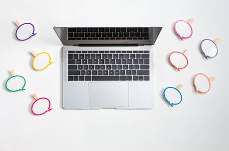 Social media concept with message bubbles and a laptop computerの写真素材